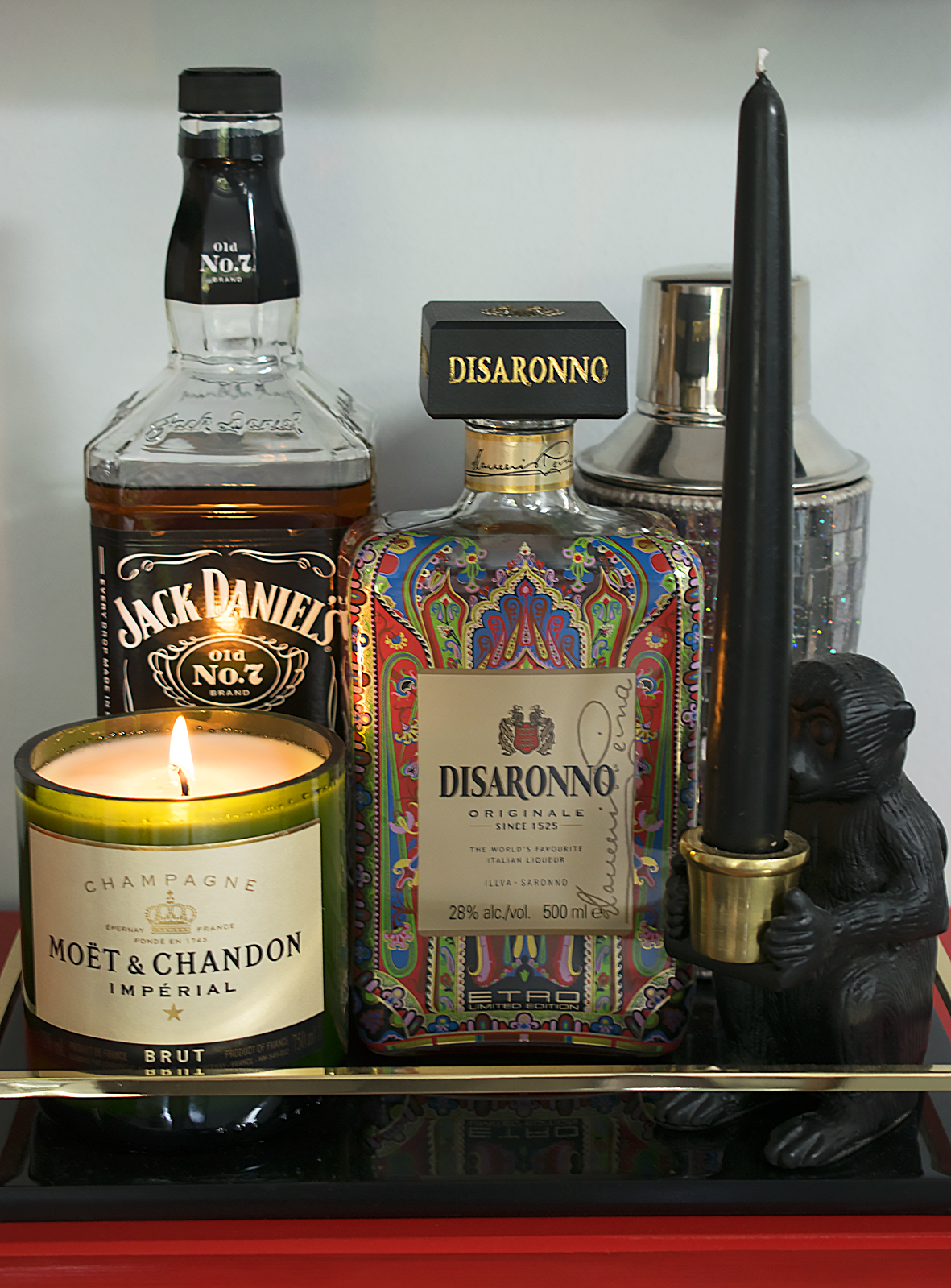 Moet candle on cocktail cabinet