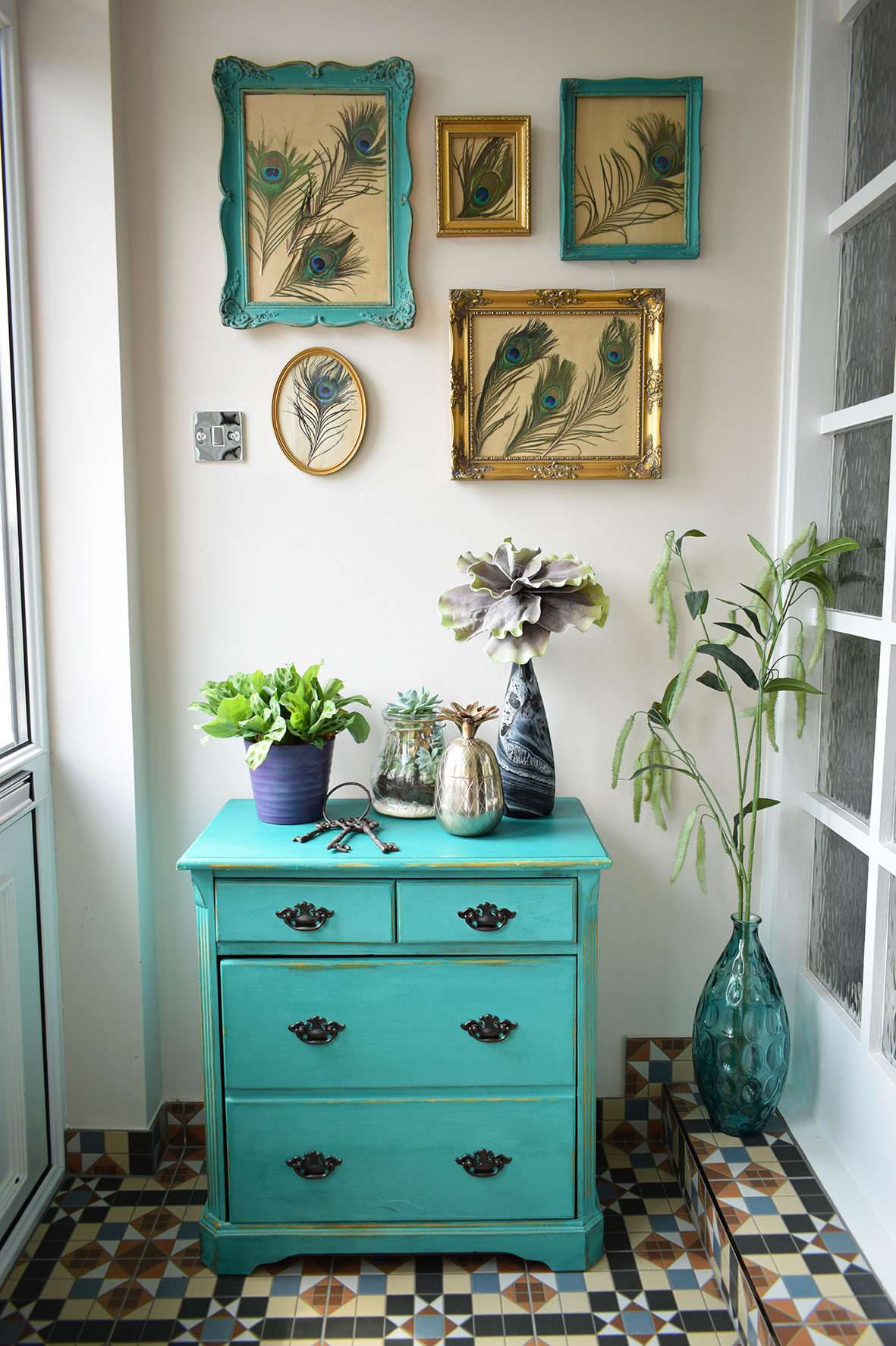 porch teal shoe cupboard, peacock design wall art and period floor tiles