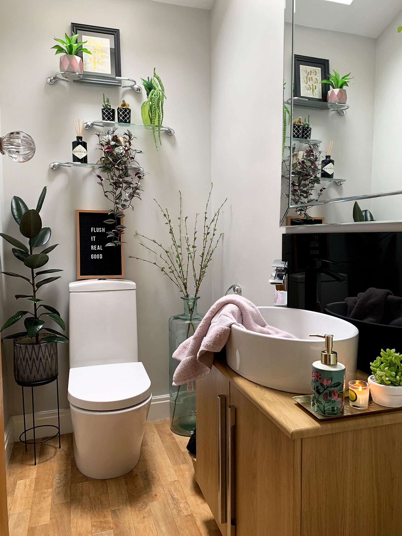 downstairs toilet with fitted sink unit, plants, shelves, accessories and karndean floor