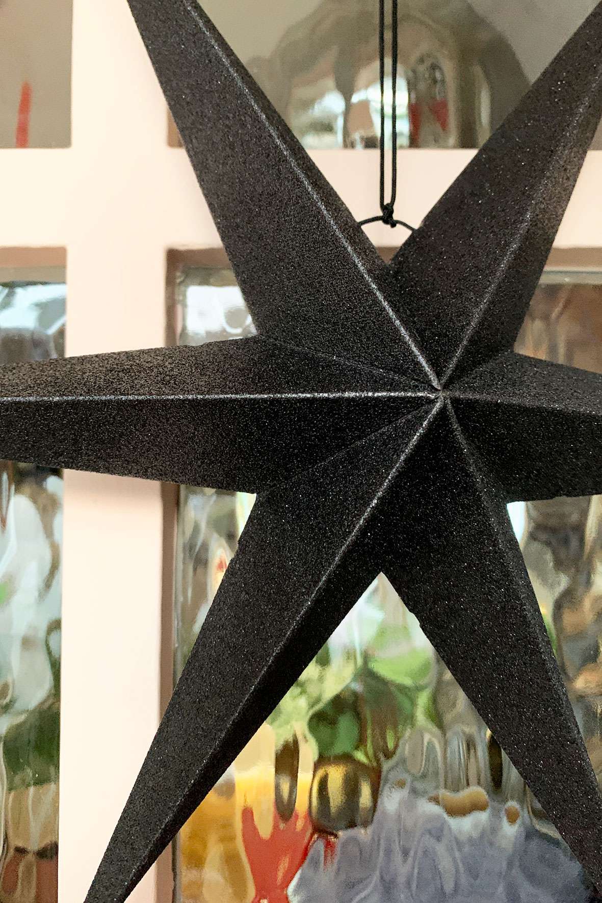 black paper glitter star close up