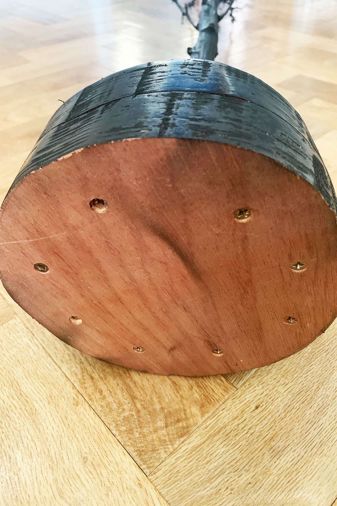 bottom of plywood Christmas tree base with screws in