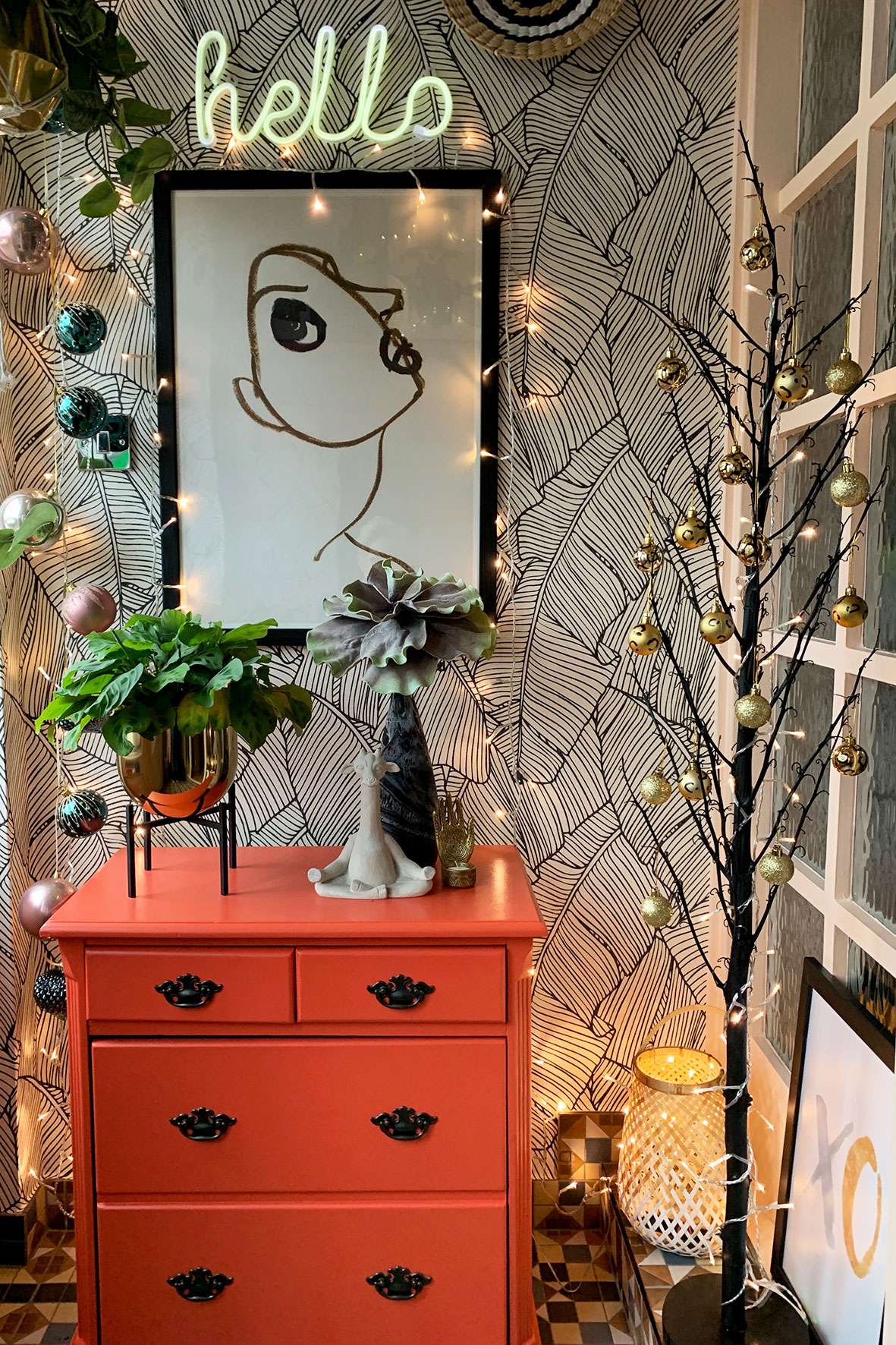 Christmas decorations and mini tree in entryway