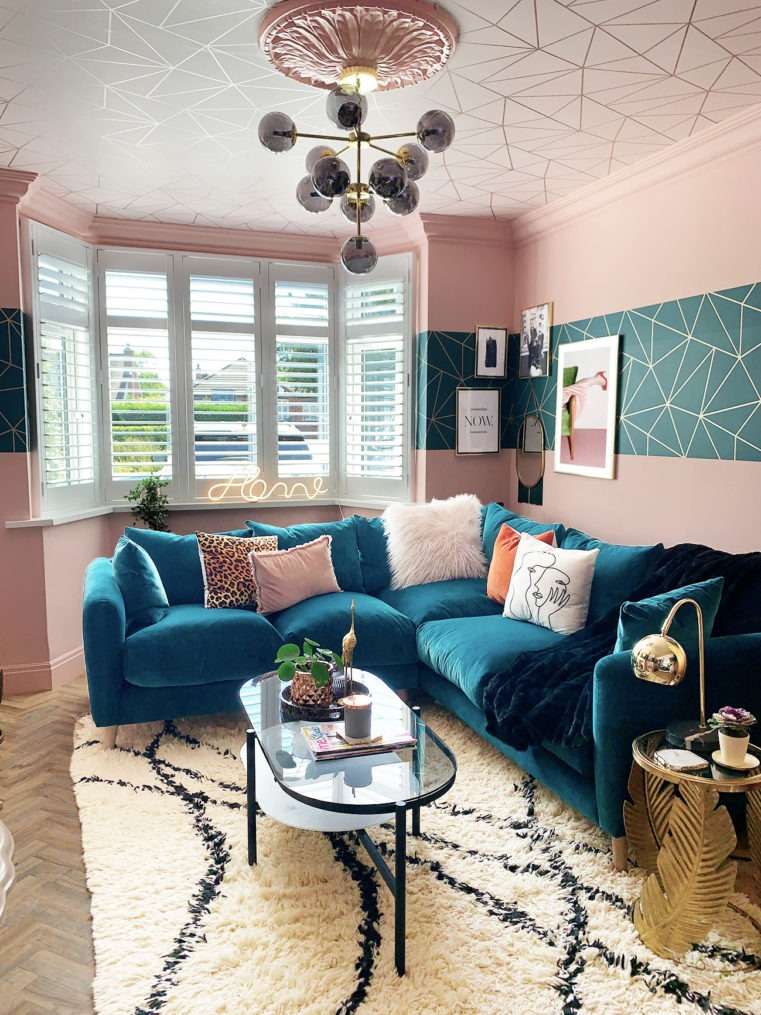 Teal velvet corner sofa in blush living room