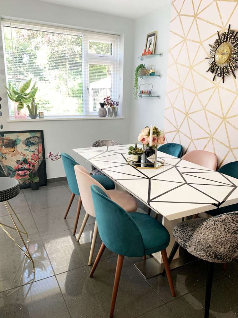 dining area with blush and teal colour and geometric scheme.