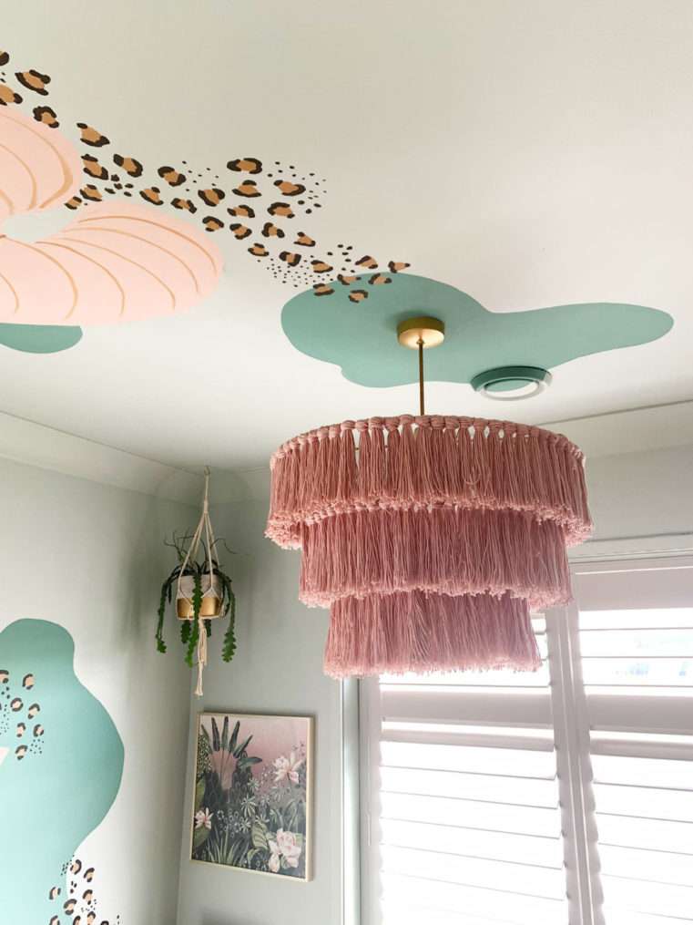 Dusty pink 3 tier tassel lampshade in soft green room.